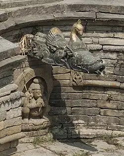 Bhagiratha beneath a spout of Sundhara, Kathmandu, Nepal