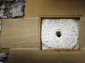 Sundial preserved amid a newer wall at SS&nbsp;Peter & Paul's in West Clandon, Surrey, England