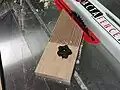 A table saw with a featherboard, a safety device used for preventing kickback.