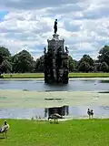 Prior to restoration, the central statue ungilded and most waterspouts were blocked