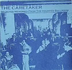 An old, washed-out photo of an early 20th century ballroom.