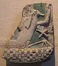 ca. 1539-1070 BC, 33.578, Brooklyn Museum. Inlaid faience tile with rebus, "All the people of the world adoring". Probably from a palace of Ramesses II or III. Height: 11.5&nbsp;cm.