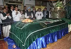 Prime Minister of India Manmohan Singh praying at the Mazar of Bahadur Shah Zafar, in Yangon, Myanmar