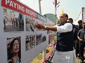 Union Home Minister paying floral tributes to fallen officers, during his visit to the Jammu and Kashmir Police Lines, in Anantnag district, 2017