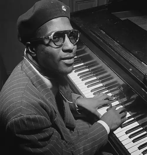 Image 11 Thelonious Monk Photograph credit: William P. Gottlieb; restored by Adam Cuerden Thelonious Monk (October&nbsp;10, 1917&nbsp;– February&nbsp;17, 1982) was an American jazz pianist and composer, and the second-most-recorded jazz composer after Duke Ellington. He had a unique improvisational style and famously remarked, "The piano ain't got no wrong notes". He made numerous contributions to the standard jazz repertoire, including "'Round Midnight", and a wide range of other compositions. He was renowned for a distinctive dress style, which included suits, hats, and sunglasses. He had disappeared from the scene by the mid-1970s and made only a few appearances during the final decade of his life. This 1947 photograph of Monk was taken by the American photographer William P. Gottlieb in Minton's Playhouse, a jazz club in New York. More selected pictures