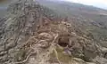 Top of the mountain showing half side of the fortification (Arabic: حِصْن ٱلْغُرَاب, romanized:&nbsp;Hiṣn Al-Ghurāb)