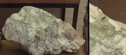 Toi ore with visible gold specks (30g of gold and 250g of silver per ton).