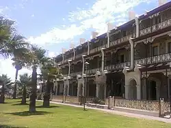 Marine Terraces, Grange Beach (1884). A key example of the Adelaide-style, with three storeys of setback filigree verandahs.[46]