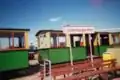 Steam tram at tramstop Valkenburgse Meer, with narrow gauge museum at the background