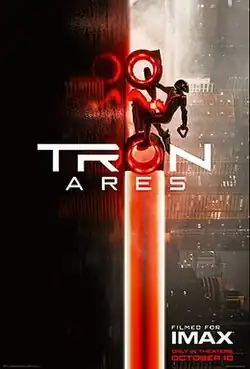 Ares rides a red Light Cycle up a road.