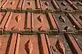 Interlocking tiles with a diamond-shaped pattern.