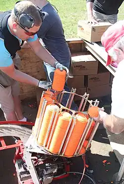 Clay targets being placed in an automatic throwing machine