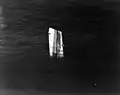The bow of USS Fiske floating in the North Atlantic after she was broken in two by a torpedo from the German submarine U-804 on 2 August 1944. This section had to be sunk by gunfire. Photographed from an airplane based on USS&nbsp;Wake Island; note the sonar dome on Fiske's keel.