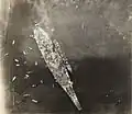 Photo taken from an airplane flying over USS Missouri. USS&nbsp;Buchanan is alongside.