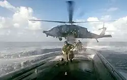 MH-60L from 160th SOAR deploys an ODA from 7th SFG(A) on board a U.S. submarine