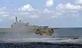 A RSN Chinook deploys a rescue diver and a raft near RSS Endeavour on 23 August 2010.