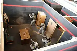 Special Forces operators from 3rd Battalion, A 10th SFG (A), conduct shoot-house training at Fort Carson in September 2009