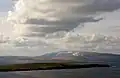 View over Uynarey looking across the islands of Uynarey and Brother Isle in Yell Sound towards Ronas Hill.