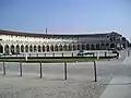 The porticoed hemicycle of the piazza