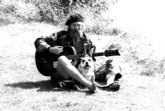 Stanshall with his bulldog Bones on a towpath in Shepperton, England, 1980