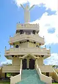 Kristus Raja Christ statue at Weluan, reflecting the region's strong Christian faith