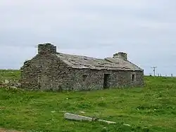 A ruined house on Westray with traditional flag-stone roof