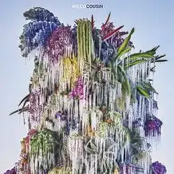 A colorful image of foliage with icicles hanging off of it