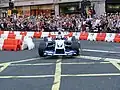 Montoya demonstrating the FW26 at Regent Street, London on 6 July 2004