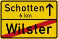 Sign 311 End of urban area (with distance to next town)