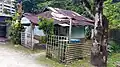 A house with a rusted zinc roof.