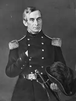 Black-and-white portrait of Anderson holding a hat